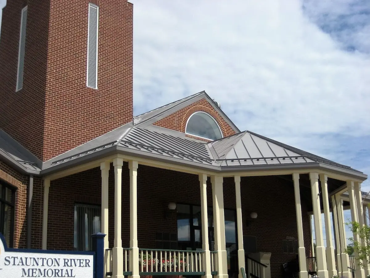 Skilled roofing craftsmen working on a residential roof in Worcester